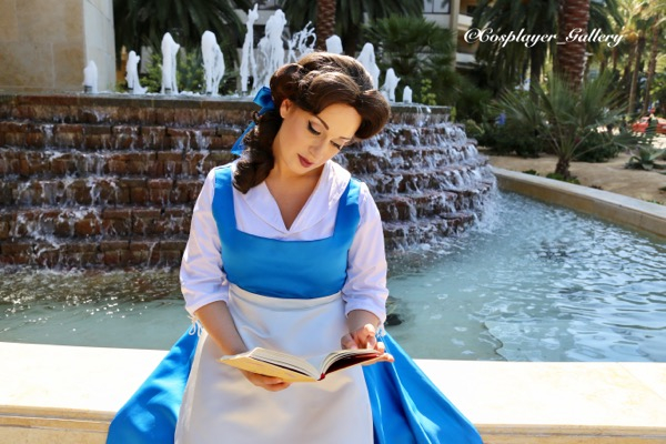 Princess Beauty reading by fountain